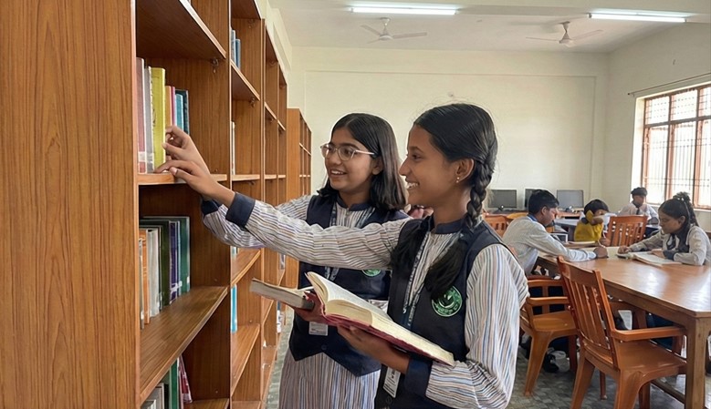 Neatly organized library shelves with books arranged alphabetically and numerically