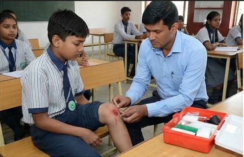 School nurse providing immediate attention to a student