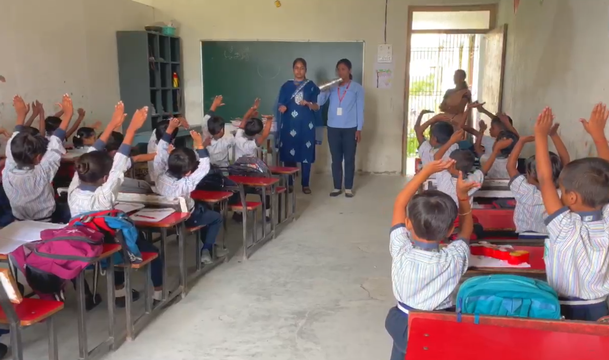 Students sitting at ergonomic desks and chairs in a classroom